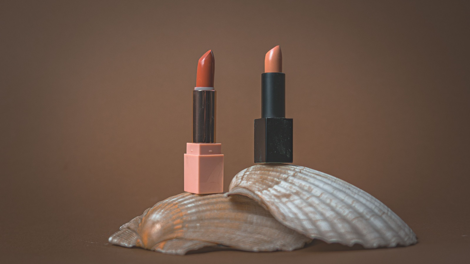 Premium cosmetic products styled on a clean background